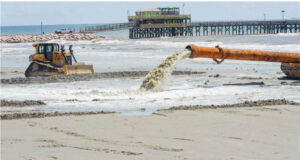 Sand pumping operation in front of the Galveston, Texas